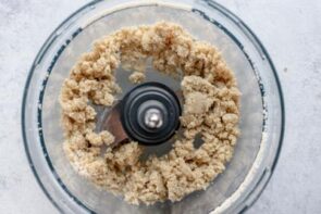 Pie crust crumbled in a food processor.