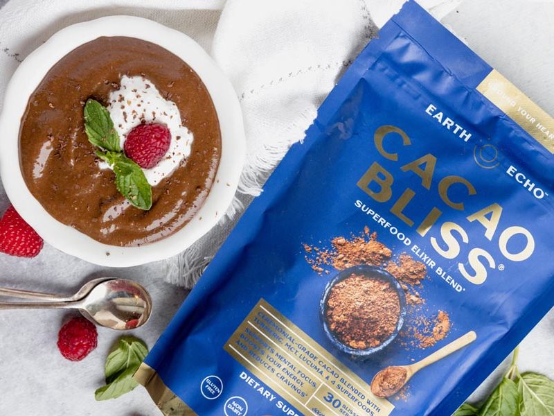 a bag of cacao bliss next to a bowl of pudding