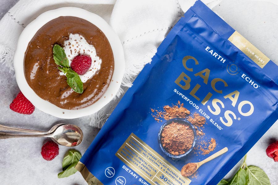 a bag of cacao bliss next to a bowl of pudding