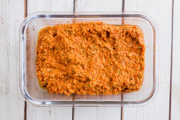 red romesco sauce in a storage container