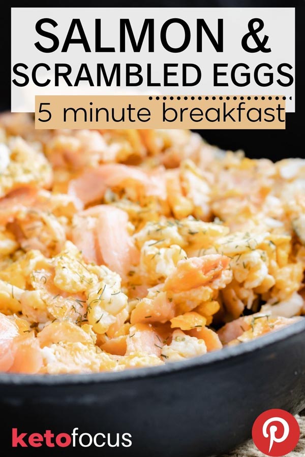 fluffy scrambled eggs mixed with smoked salmon and dill in a cast iron skillet