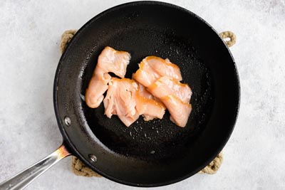 smoked salmon cooking in a skillet
