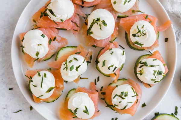 a plate with salmon cream cheese bites on it