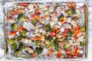 baked chicken and veggies on a sheet pan