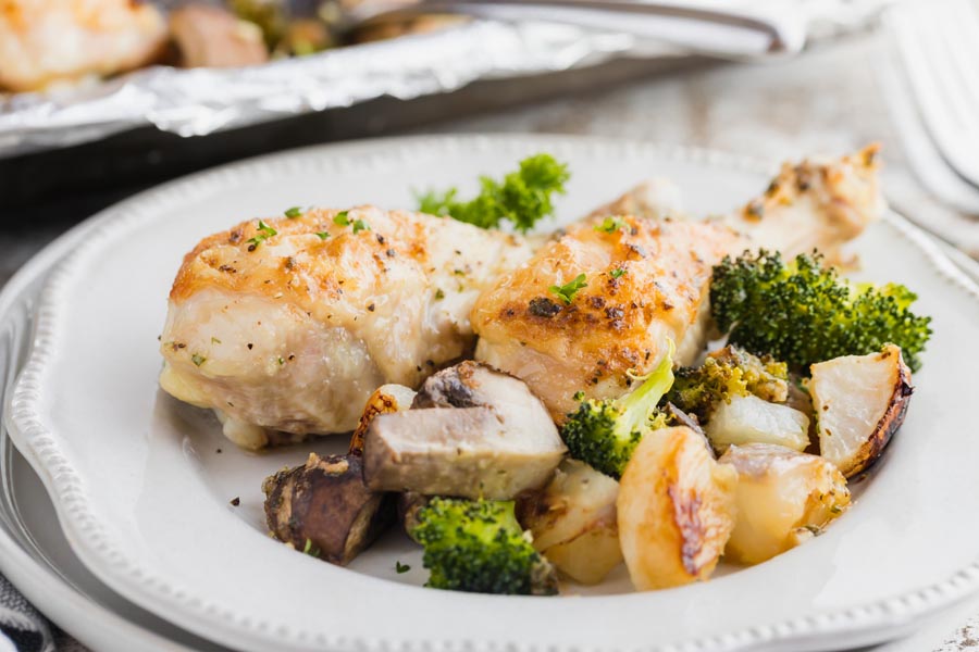 chicken and vegetable dinner on a white plate