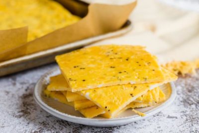 a bunch of sliced eggs on a plate with a tray behind