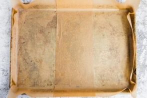 parchment paper lining a sheet pan