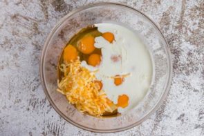 eggs, cream and cheese in a bowl