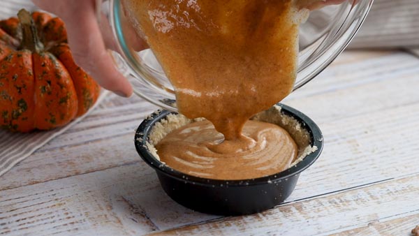 pouring filling into pie crust