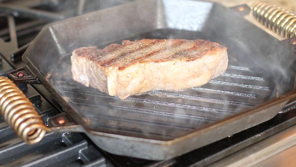 cooking a steak in a castiron skillet