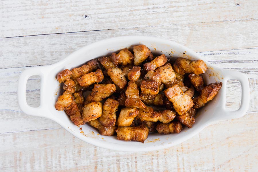 a bowl of fried pork belly