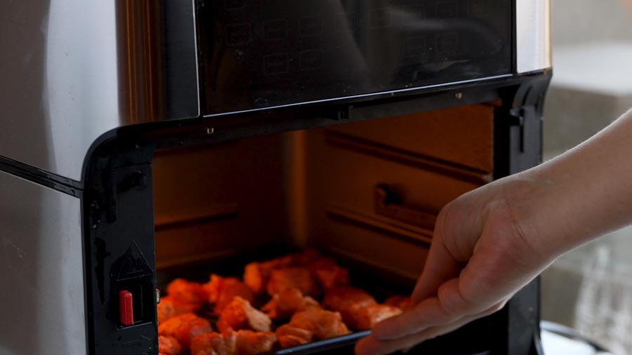 inserting pork belly into the air fryer