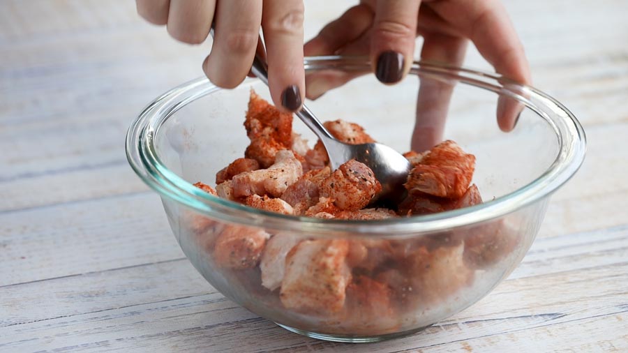 mixing the pork belly in the seasoning