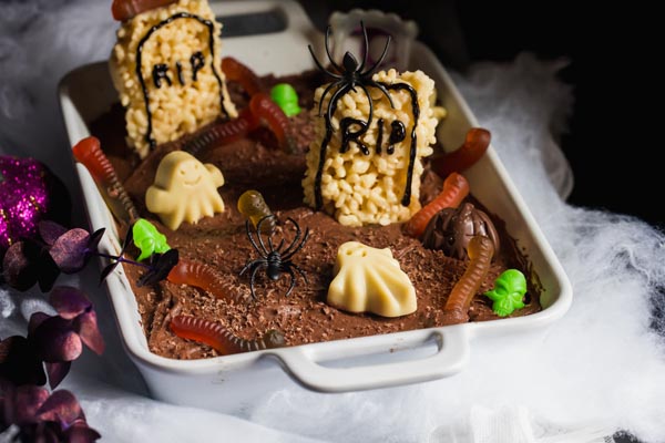 spooky dark graveyard cake with fog coming out