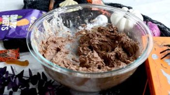 creamy chocolate buttercream frosting in a mixing bowl