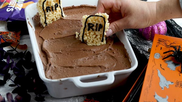 place a sugar free rice krispie treat down as a tombstone in a graveyard cake