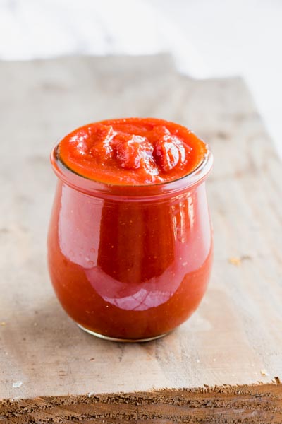 a mason jar filled to the top with ketchup