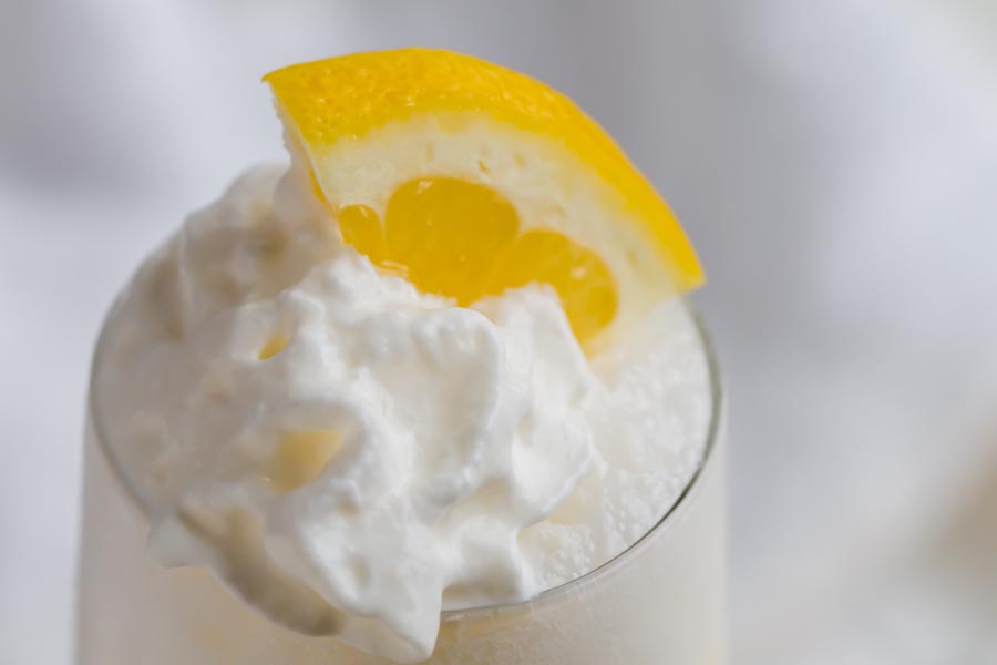 close up of whipped cream topped sugar free frozen lemonade