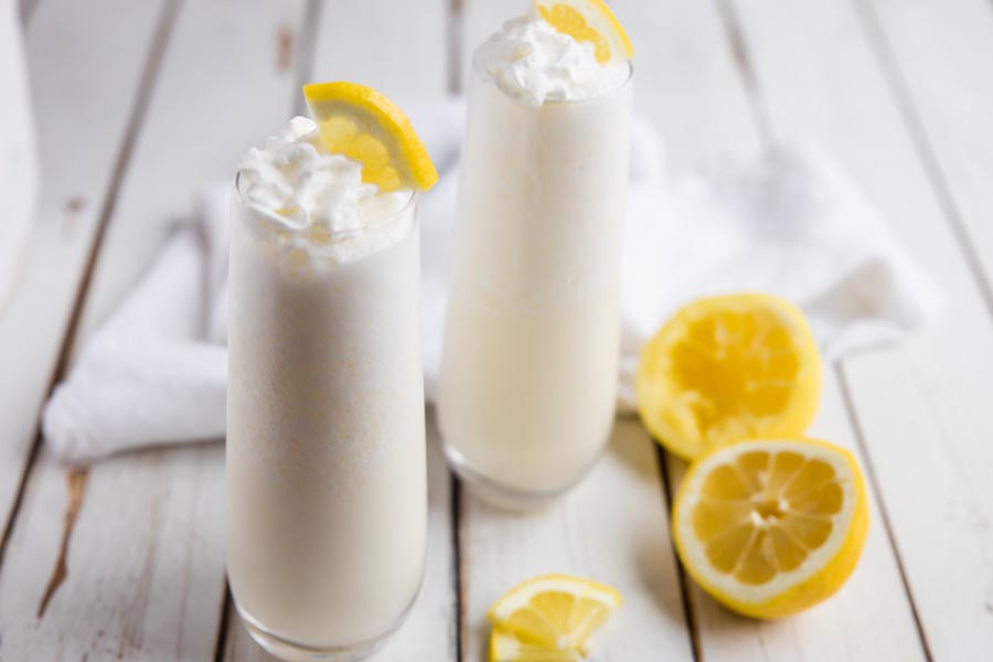 creamy chick-fil-a frozen lemonade in a clear glass with white background