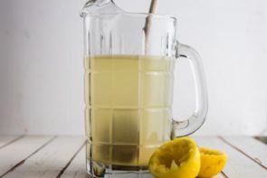 a pitcher with sugar free lemonade inside with a wooden spoon
