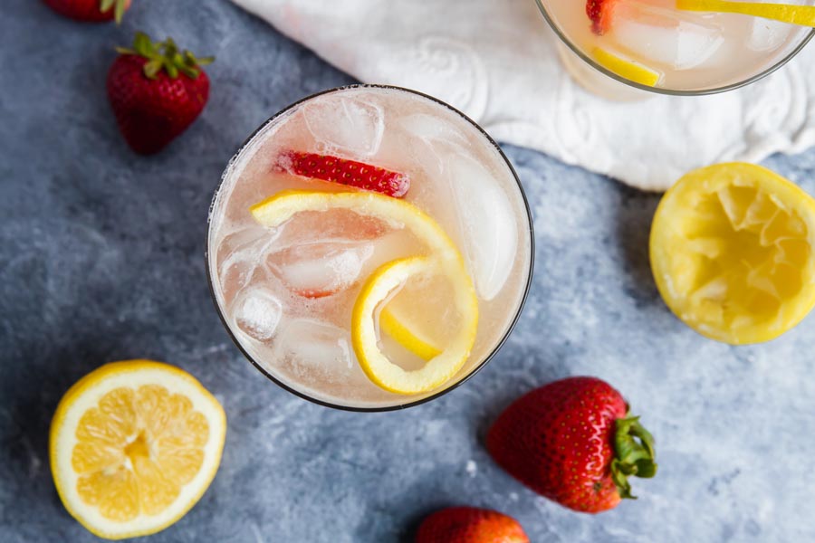 overhead shot of a glass of refreshing keto strawberry lemonade with ice