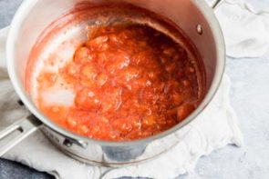 strawberries and juices in a saucepan