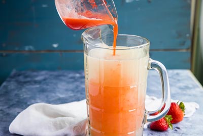 pouring keto lemonade into a glass