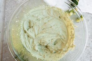 a bowl of whipped cream that is green