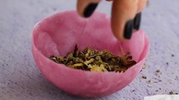 filling a half moon candy shell with loose tea