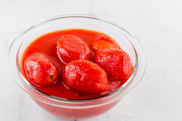 canned tomatoes in a glass bowl