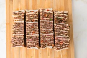 Three sliced tortilla kebab strips arranged side by side before adding skewers.