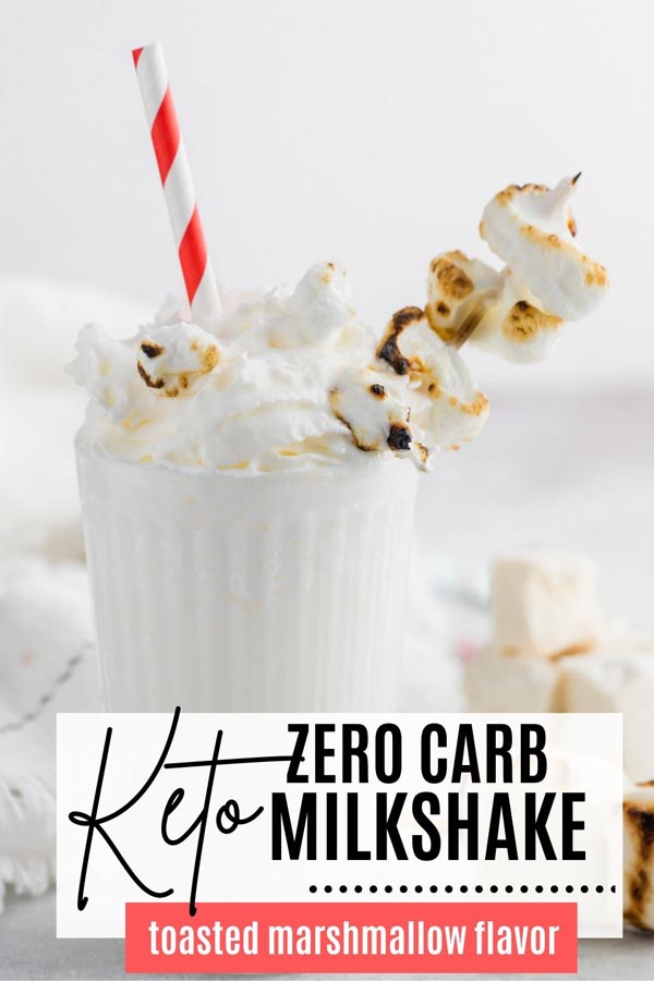 white creamy milkshake with whipped cream and toasted marshmallow on top